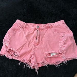 Distressed pink shorts